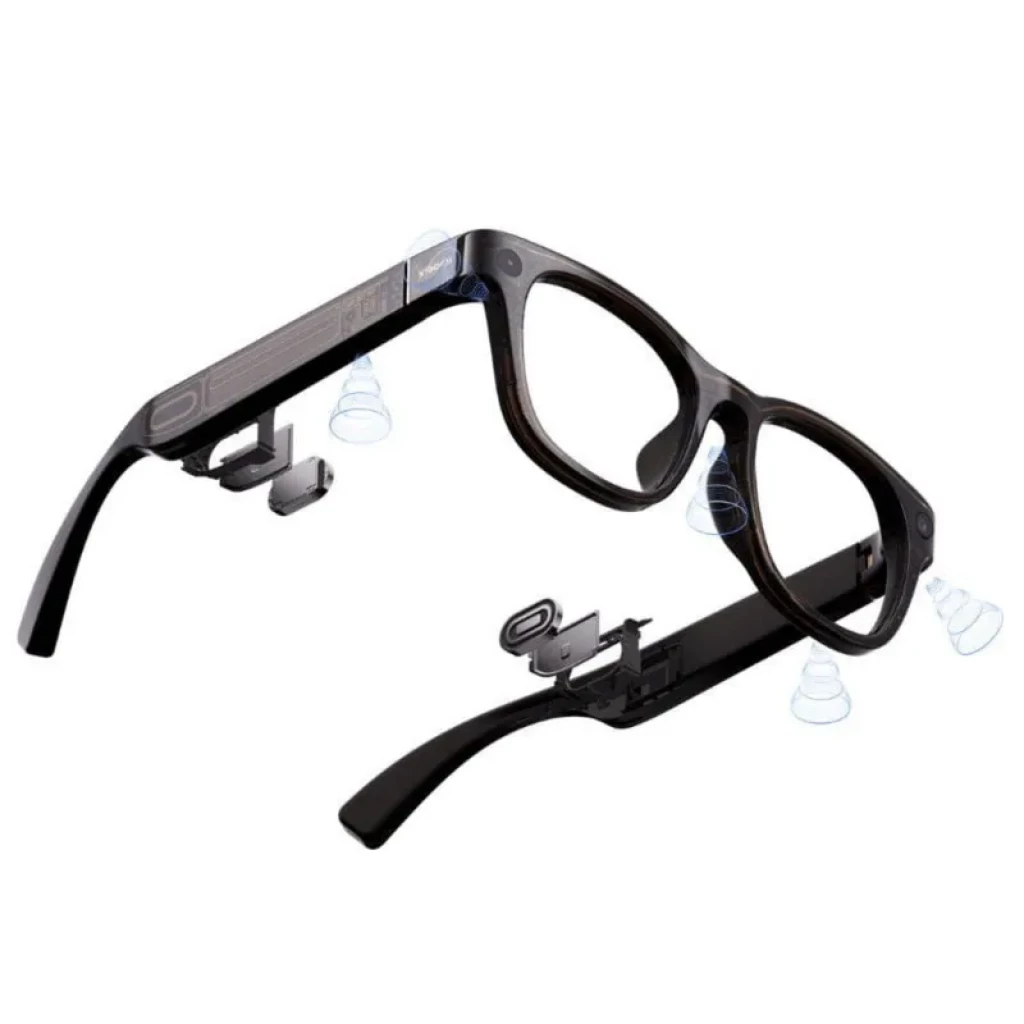 Xiaomi AI Glasses avec monture noire, branches épaisses intégrant haut-parleurs et microphones, composants internes visibles, design technologique et