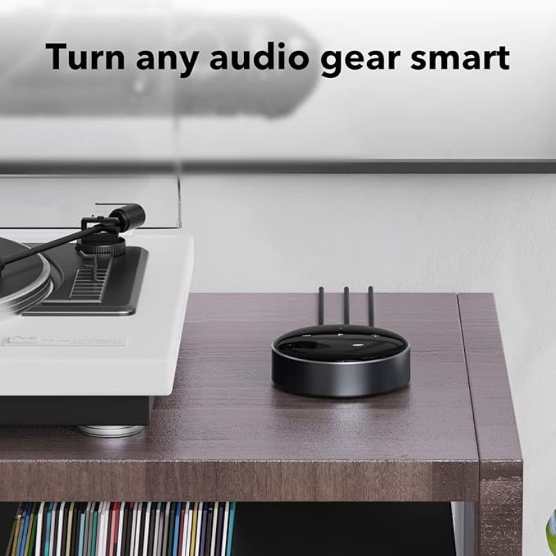 FiiO WiiM Mini - Reproductor de audio compacto circular negro con botones táctiles, puertos Aux In/Out, óptico, Bluetooth y luces LED indicador