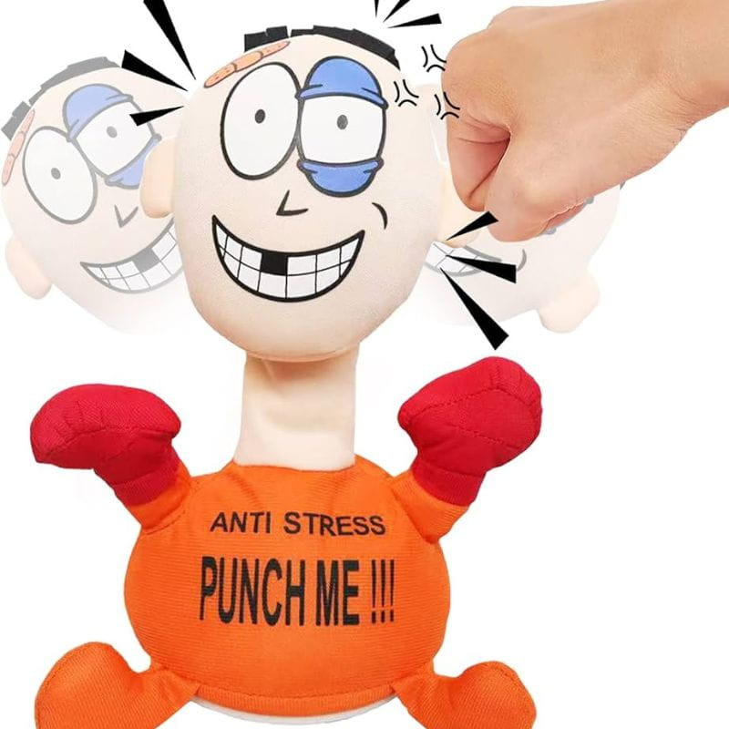 Muñeco Pablo Anti Stress "Punch Me" Naranja: figura con cabeza grande, guantes rojos, base de ventosa y texto “PUNCH ME”; diseño divertido para golpear y