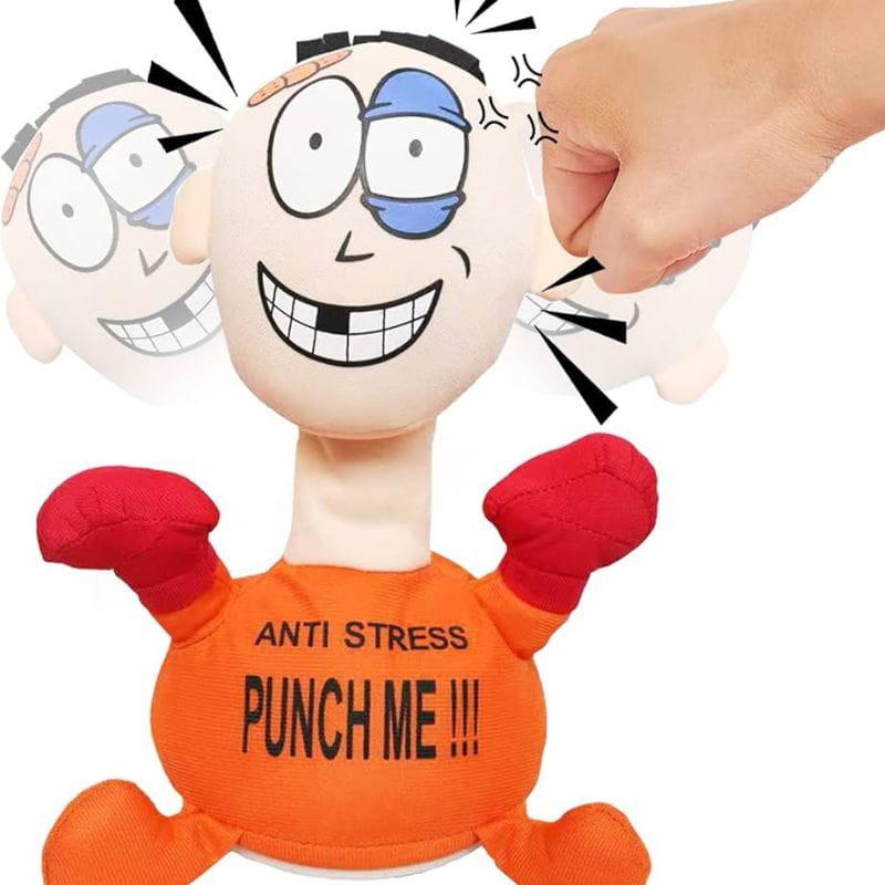 Muñeco Pablo Anti Stress "Punch Me" Naranja: figura con cabeza grande, guantes rojos, base de ventosa y texto “PUNCH ME”; diseño divertido para golpear y