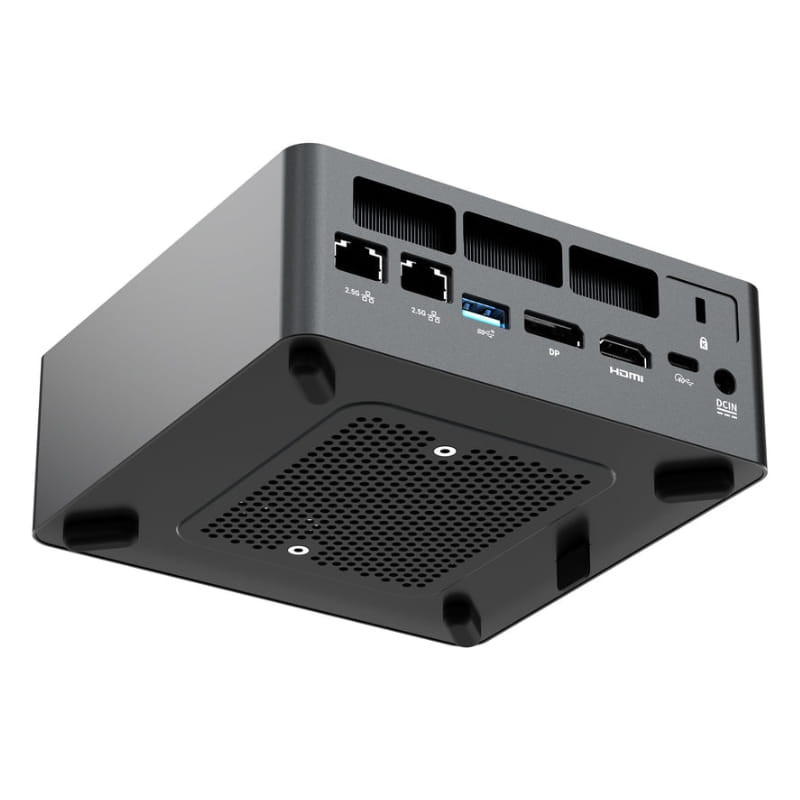 Mini PC compacto en negro con ventilación inferior y múltiples puertos traseros: 2 LAN, USB-A, USB-C, HDMI, DisplayPort, audio y DC IN