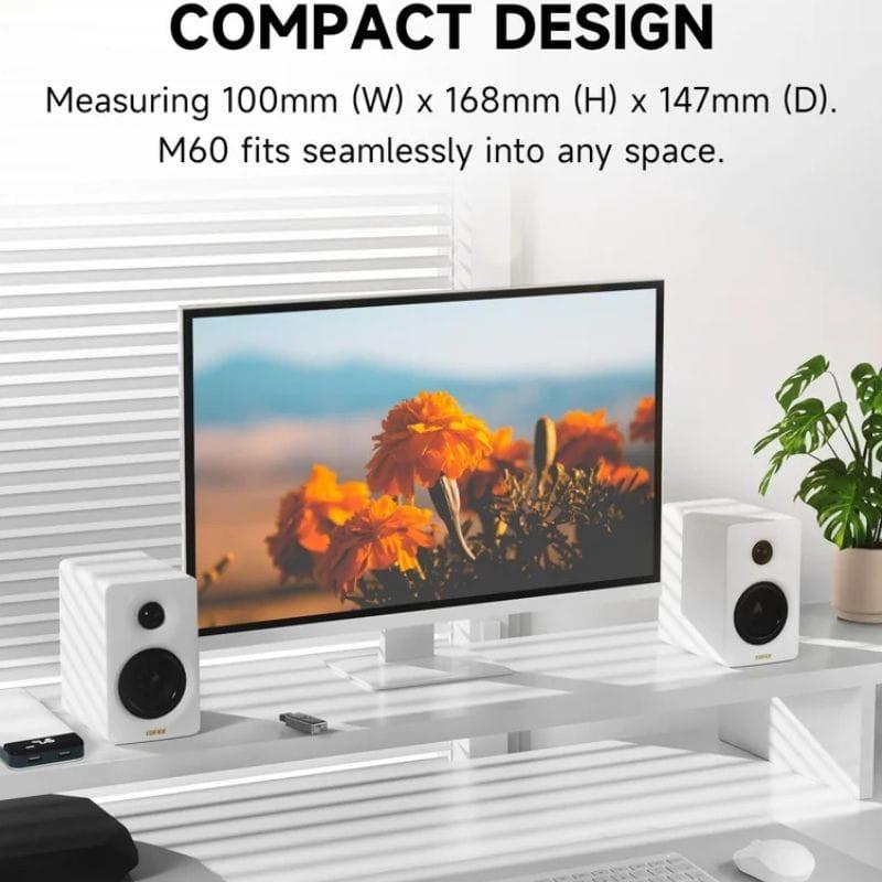 Edifier M60 Colunas Ativas Preto com design compacto, duas colunas brancas com woofer e tweeter, grelha frontal e acabamento minimalista para desktop