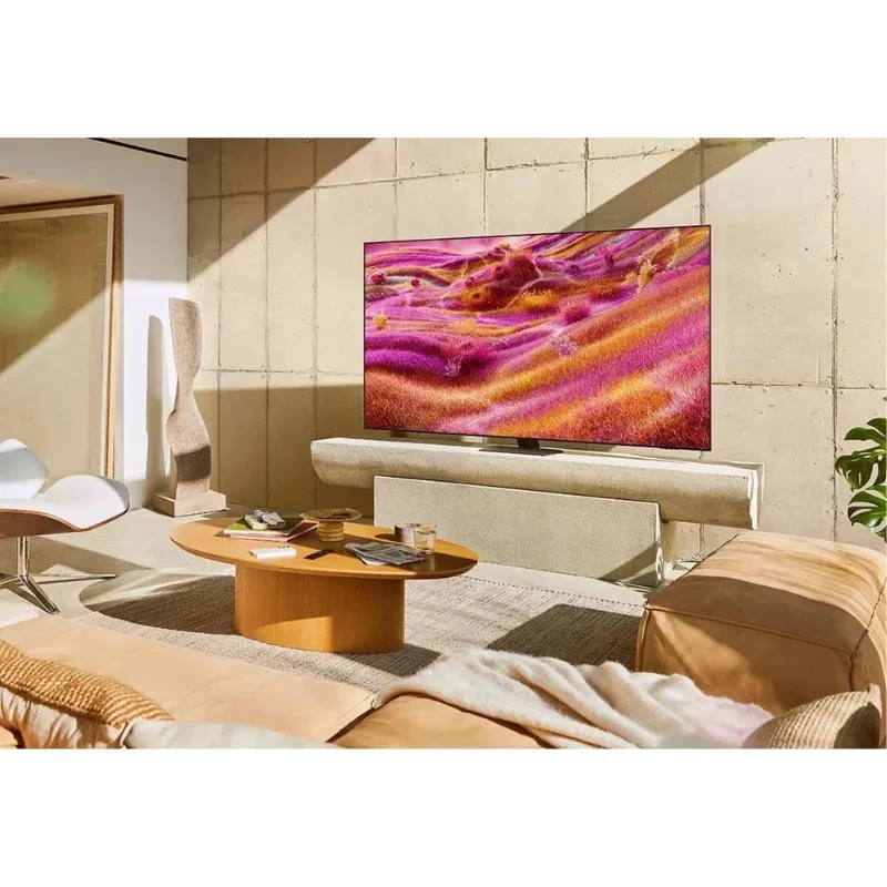 Samsung TQ85QN90FAT 85 pulgadas 4K Neo QLED con panel ultrafino, biseles mínimos y colores vibrantes; montada sobre base central en sala moderna